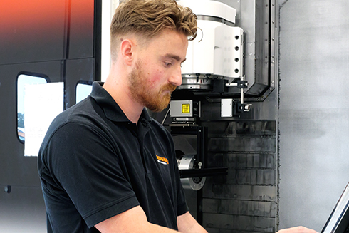 Engineer setting up a test using XM-60 multi-axis calibrator on machine