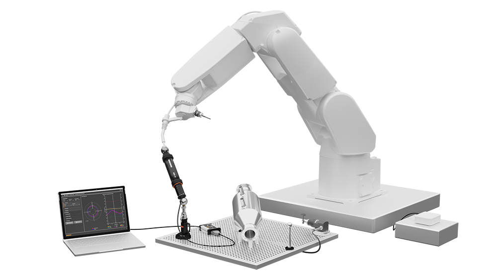 Six-axis robot performing a volumetric test with RCS L-90 before probing a workpiece. Graph result is shown on a laptop.