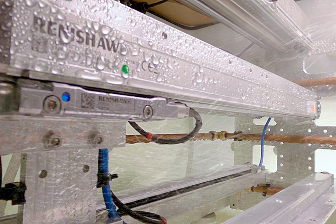 FORTiS encoder covered in water droplets in an Ingress Protection (IP) testing environment