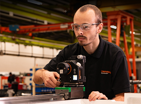 Operator using XK20 alignment laser system on carriage