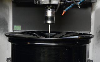 SAI - RMP60 performing in-line measurement for wheel rim production.