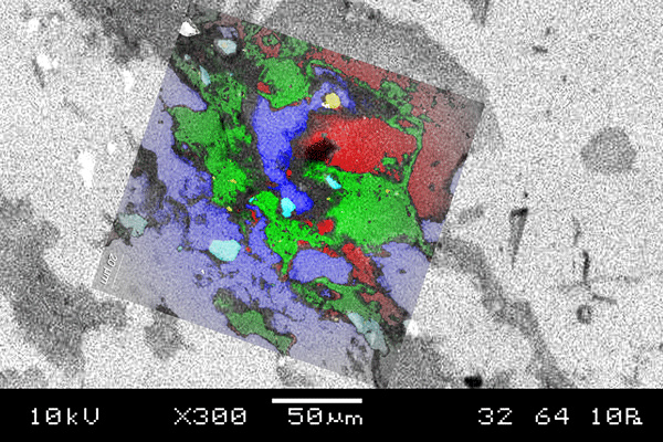 SEM and Raman overlay of a geological sample