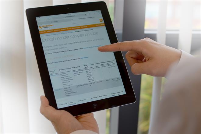 Optical encoders comparison table on a tablet screen with a hand scrolling