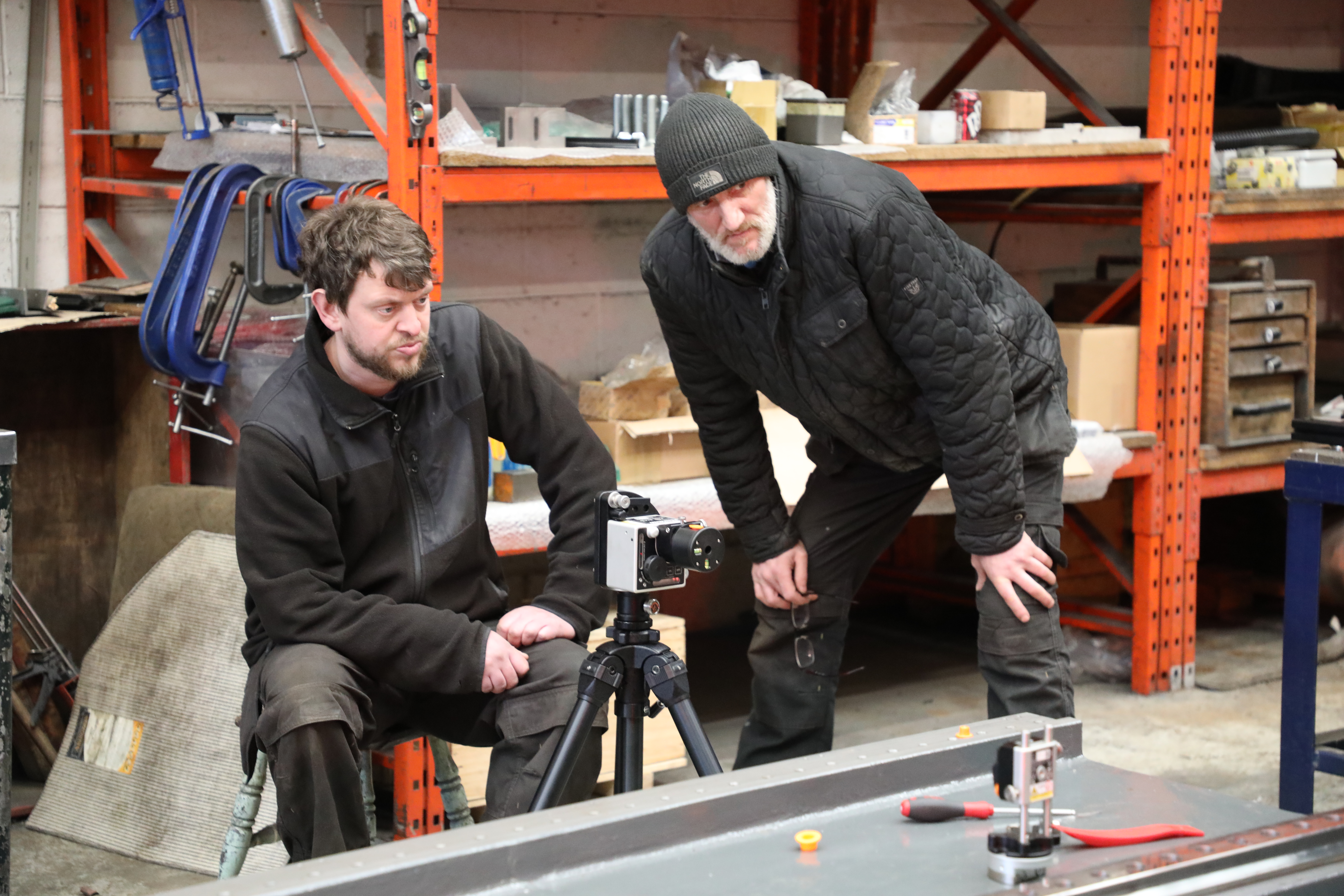 Two operators setting up an XK10 alignment laser system