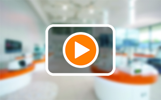 Illustration showing a video play button within a transparent black box, sitting on a blurred, light background