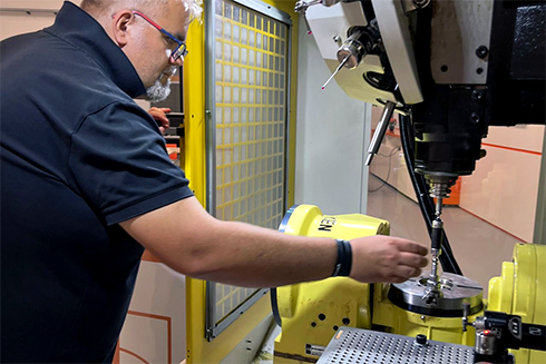Engineer putting QC20 ballbar into a machine